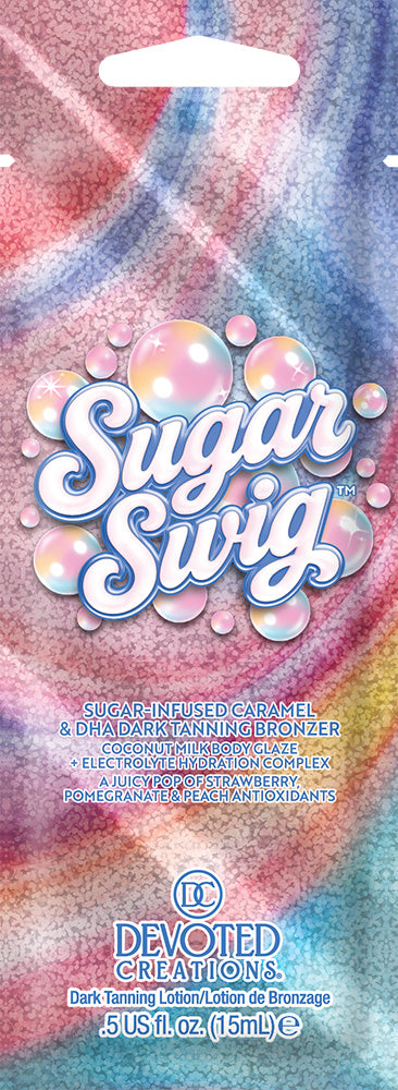 A single use packet of Devoted Creations Sugar Swig Dark Tanning Lotion & Bronzer, featuring a colorful pastel marbled design in pink, blue, and purple with white bubble graphics and the brand name 'Sugar Swig' in large white letters.