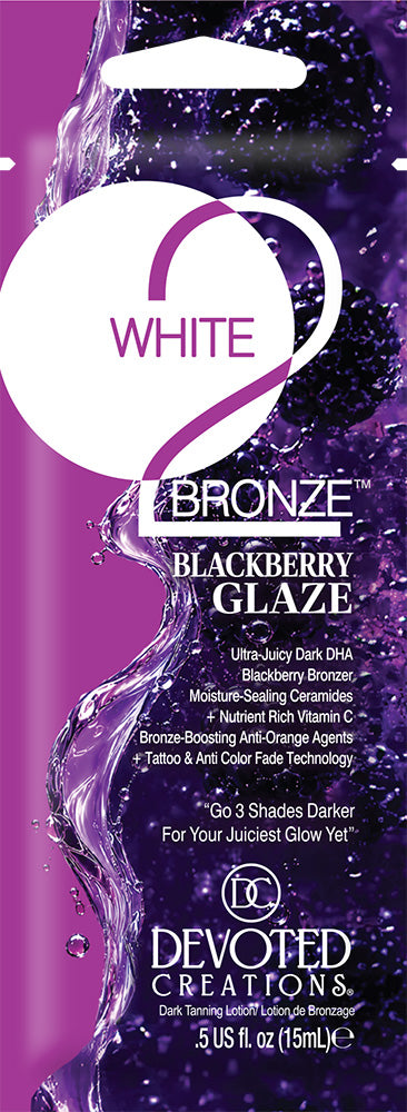 A single use packet of Devoted Creations White 2 Bronze Blackberry Glaze tanning lotion, featuring a purple and black label with a white cap.
