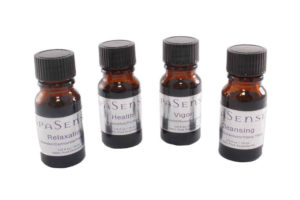 Four small bottles of a product line with labels on a white background