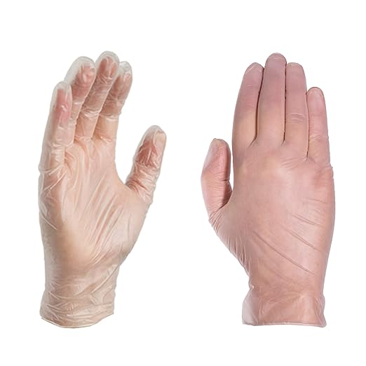 Pair of transparent vinyl gloves on a white background