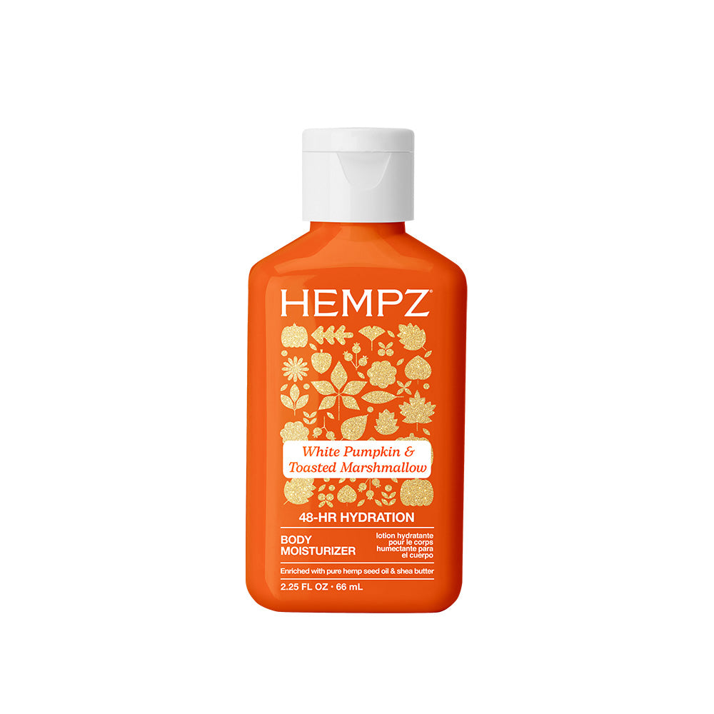 Orange bottle of Hempz body moisturizer with white cap on a white background
