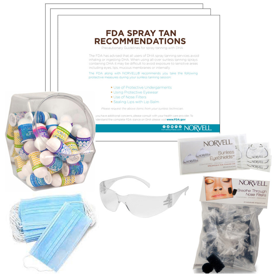 Spray tan kit with masks, goggles, and Norvell products on a white background