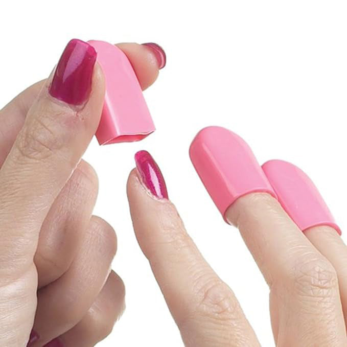 A model putting nail savers on her fingers on a white background