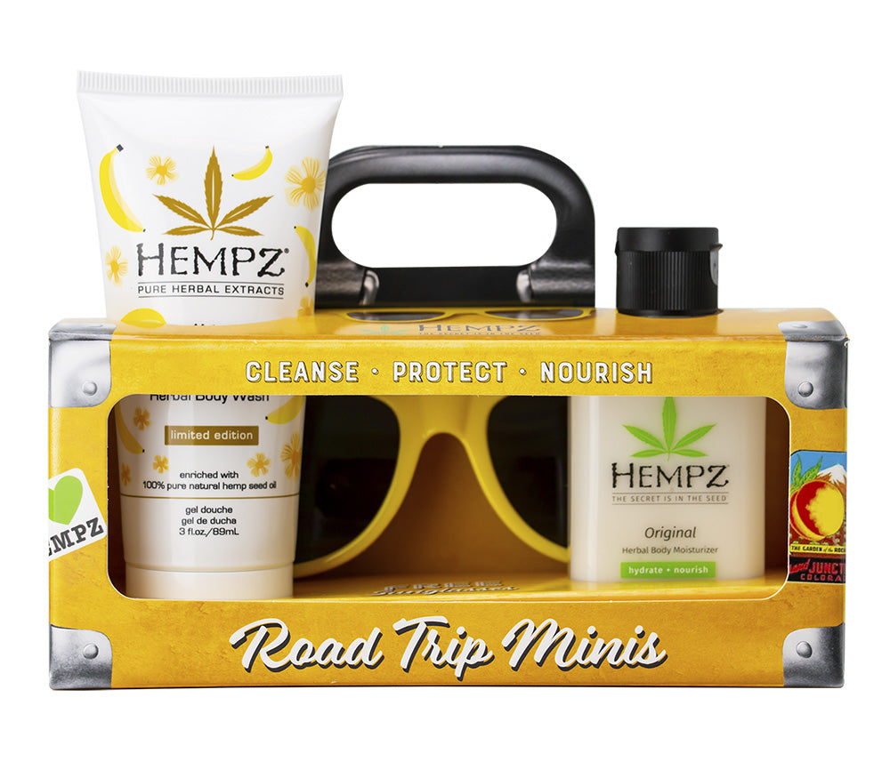 Hempz Road Trip Minis set with bottles, a tube, and sunglasses on a white background