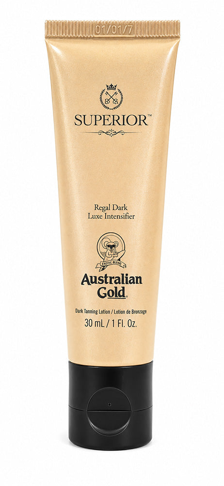 A 30 mL squeeze tube of Australian Gold Superior Regal Dark Lume Intensifier hair dye, in a metallic gold color with a black cap, on a white background.