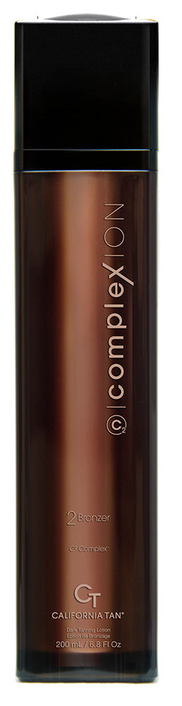 A tall, dark brown bottle with a black cap and black base, featuring vertical white text that reads '@complexion' and 'CALIFORNIA TANK' near the bottom, shown on a plain white background.