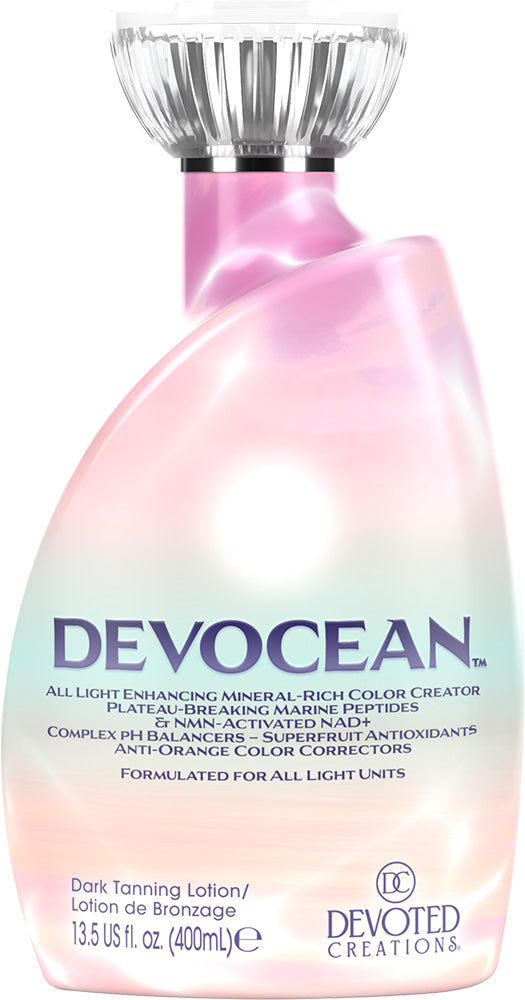A bottle of Devocean Dark Tanning Lotion by Devoted Creations, featuring a pink gradient bottle with a clear cap, on a white background.