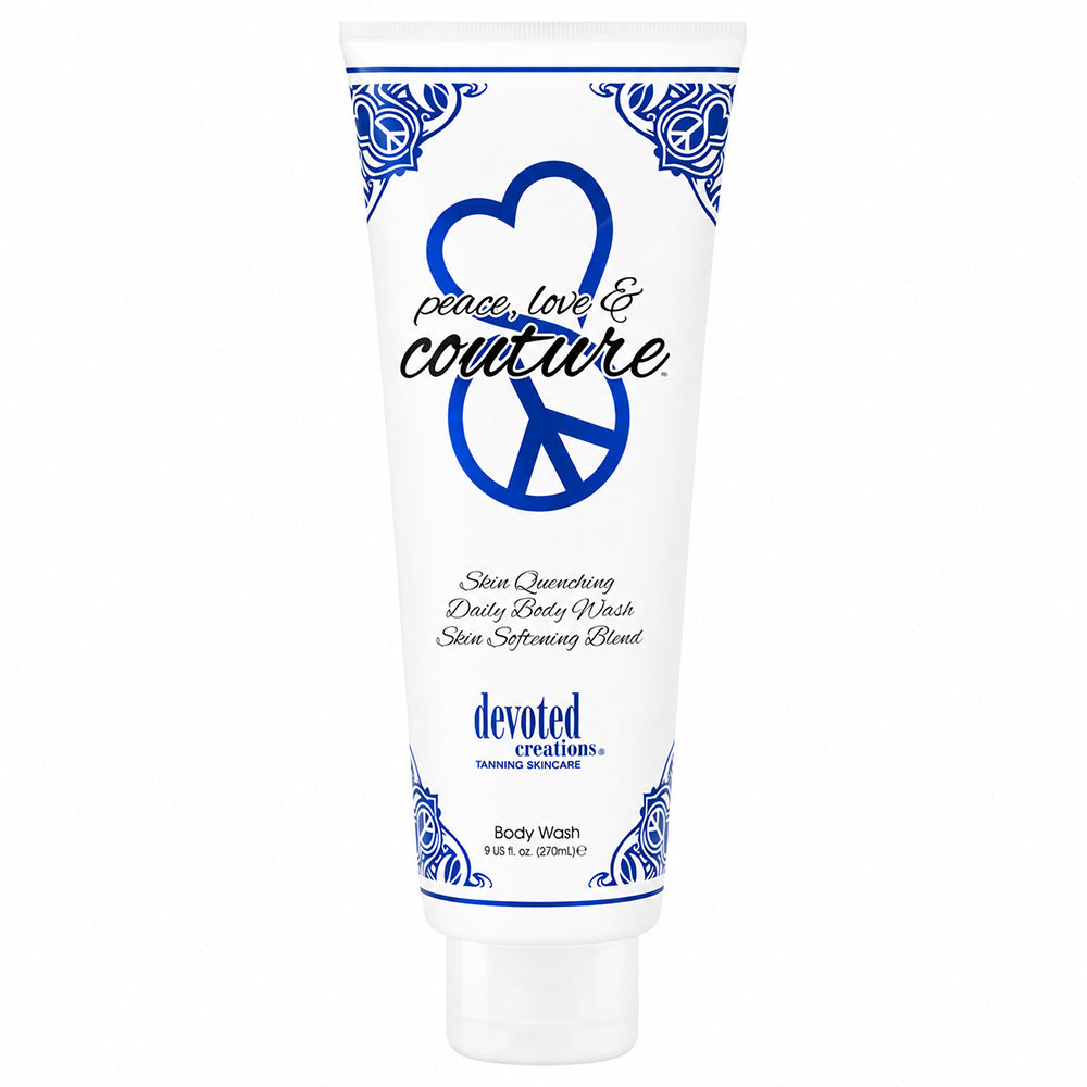 A white squeeze tube of Devoted Creations Body Wash with blue decorative borders, a peace sign, and the text 'peace, love & couture' on a plain white background.