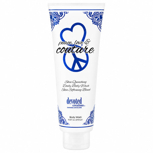 A white squeeze tube of Devoted Creations Body Wash with blue decorative borders, a peace sign, and the text 'peace, love & couture' on a plain white background.