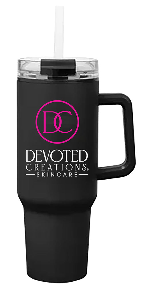 Black tumbler with handle featuring 'Devoted Creations Skincare' logo on a white background