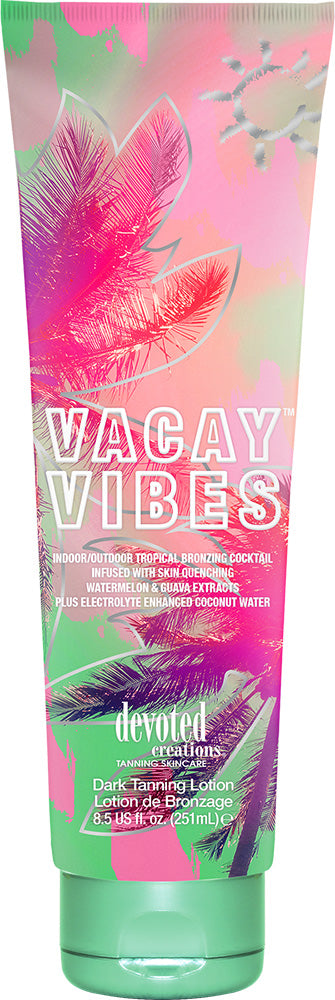 A tube of Devoted Creations Vacay Vibes tanning lotion with a vibrant pink and green design, indicating it's enriched with electrolyte, coconut water, and melanin stimulators.
