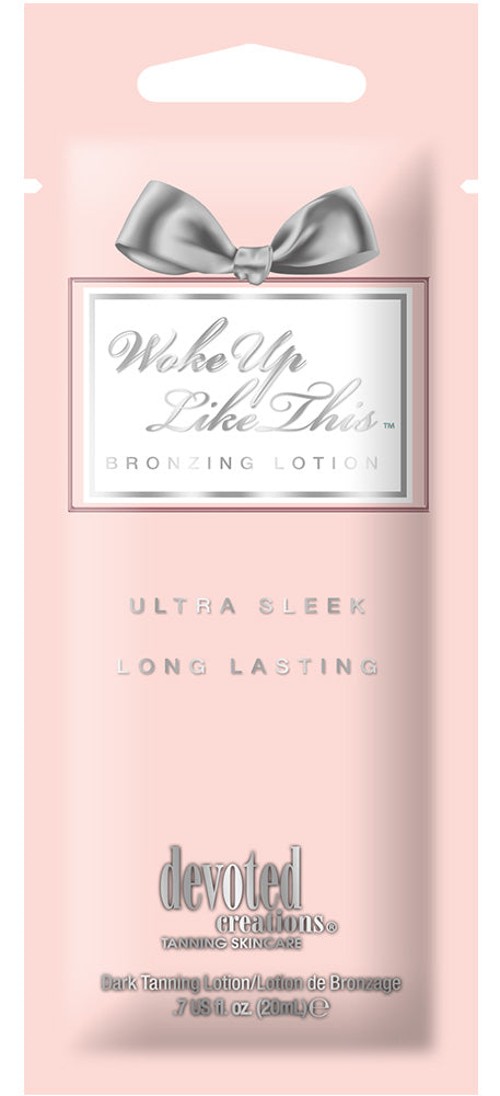 Devoted Creations Woke Up Like This tanning lotion featuring a silver bow and a light pink background 