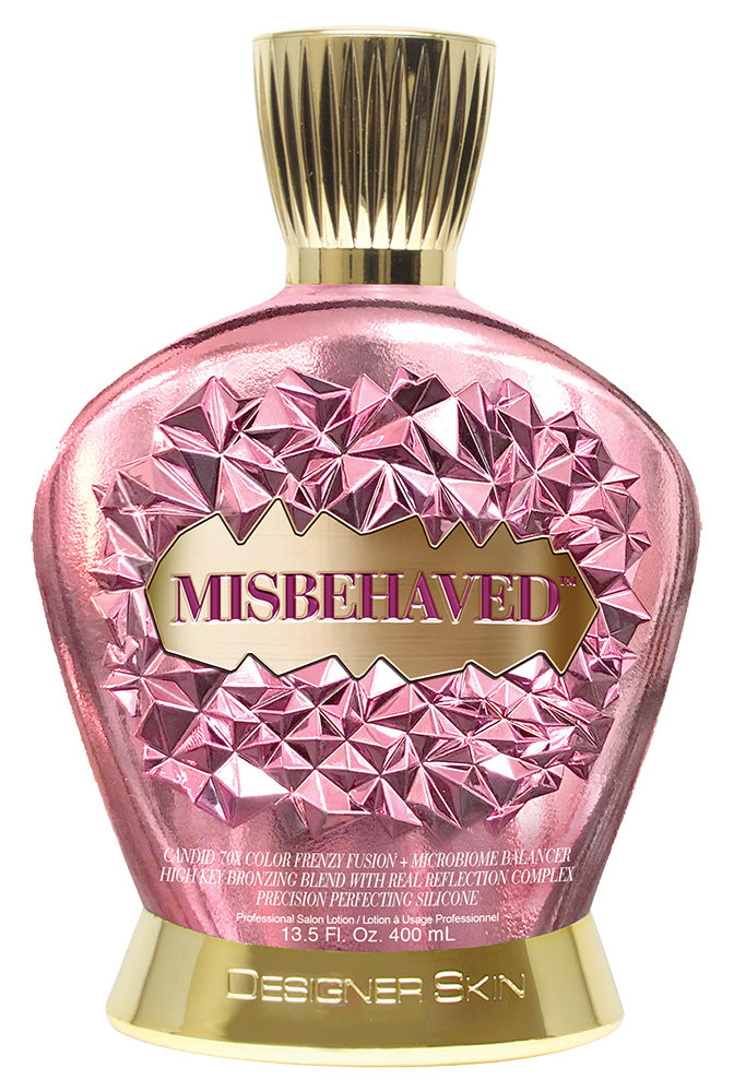 Pink and gold bottle labeled 'Misbehaved' by Designer Skin on a white background