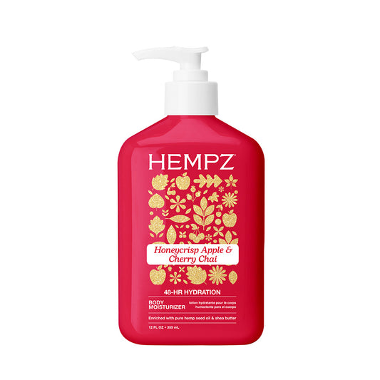 Red bottle of Hempz body moisturizer with white pump on a white background