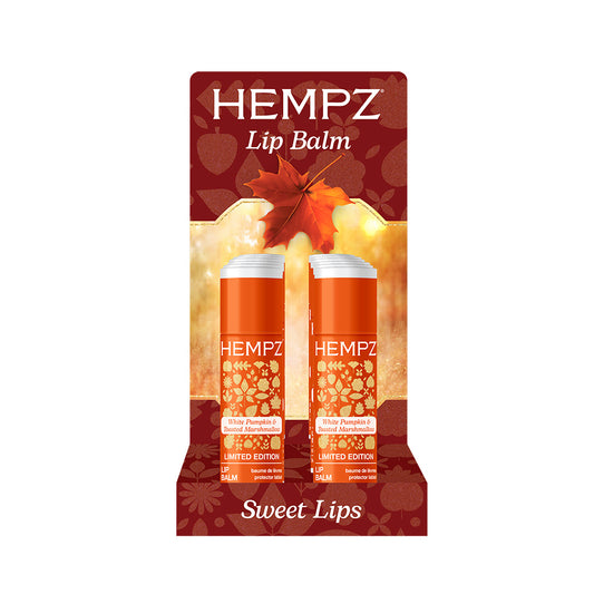 Hempz lip balm packaging with autumn leaves on a white background