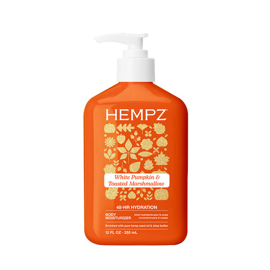 Orange bottle of Hempz White Pumpkin & Toasted Marshmallow body moisturizer on a white background