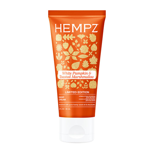 Hempz hand cream tube with white pumpkin and toasted marshmallow flavor on an orange background