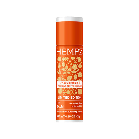 Hempz lip balm tube with orange and white design on a white background