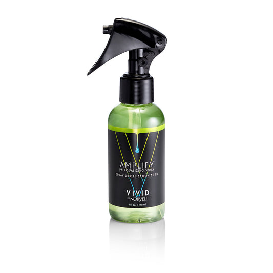 Green spray bottle with black nozzle on a white background