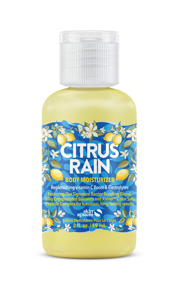 A bottle of Skin on Point Citrus Rain Body Wash, featuring a yellow and blue label with citrus and floral illustrations, set against a plain white background.