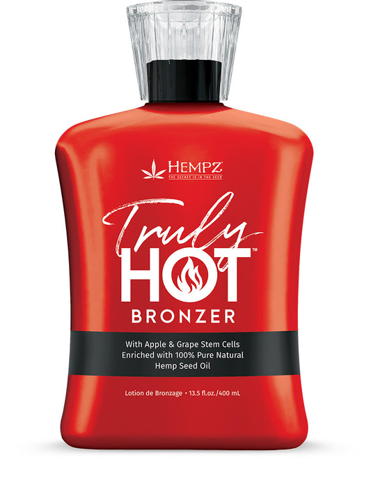 Red bottle of Hempz Truly Hot Bronzer on a white background