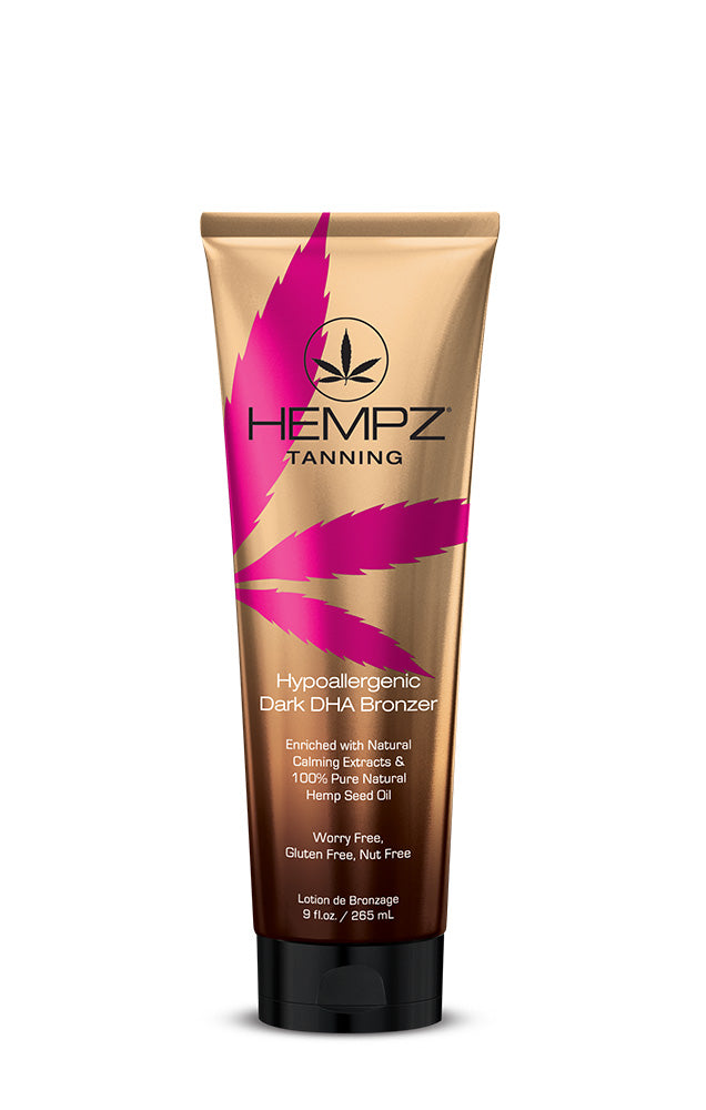 SU hypoallergenic bronzer featuring a gold tube bottle with a pink hemp leaf 