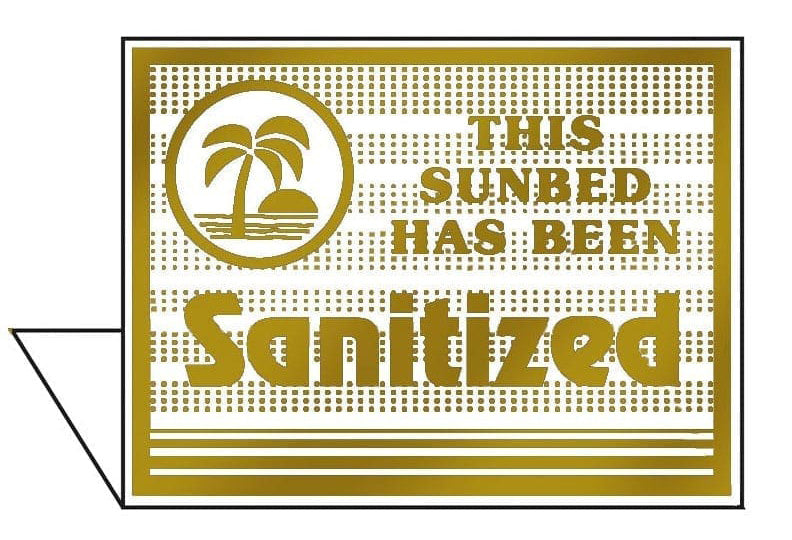 Gold sign with palm tree design and text 'This sunbed has been sanitized' on a white background