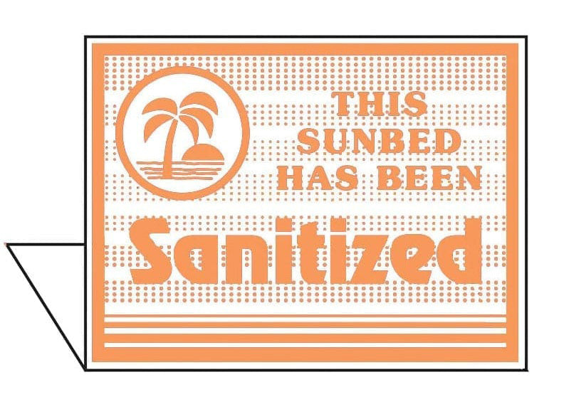 Sign indicating a sunbed has been sanitized with a palm tree design.