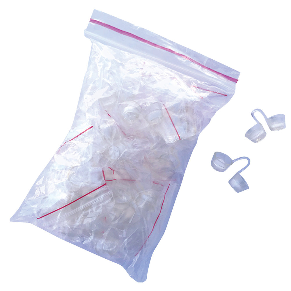 Clear plastic bag with red zipper containing small white objects, with additional white objects on a white background.