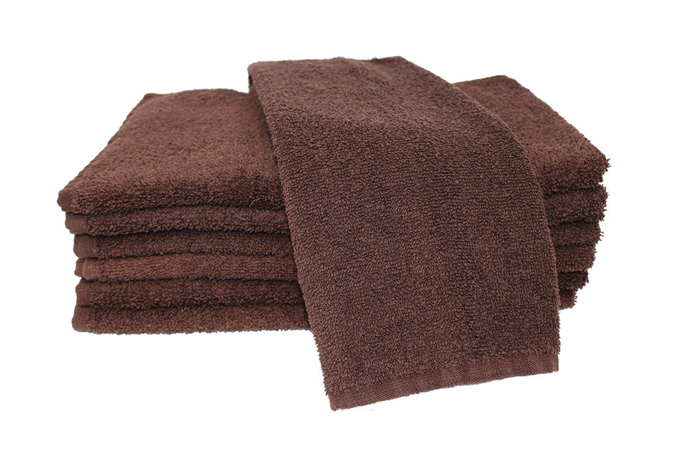 Stack of brown towels on a white background