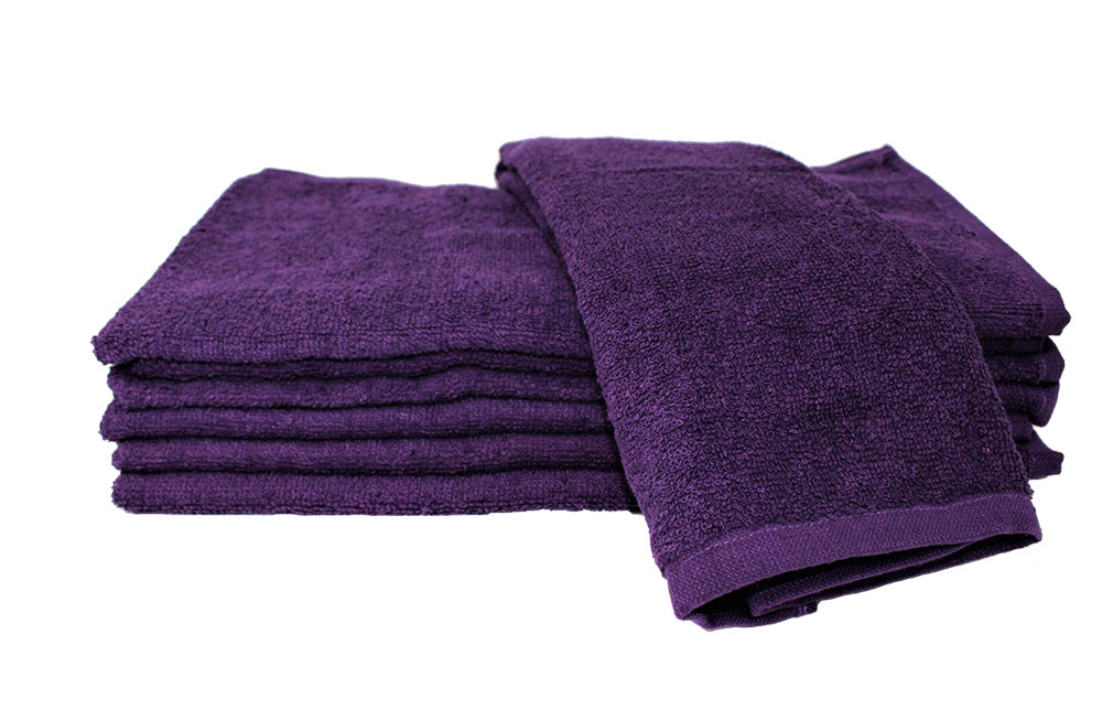 Stack of purple towels on a white background