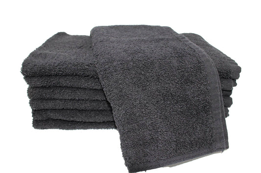 Stack of dark gray towels on a white background